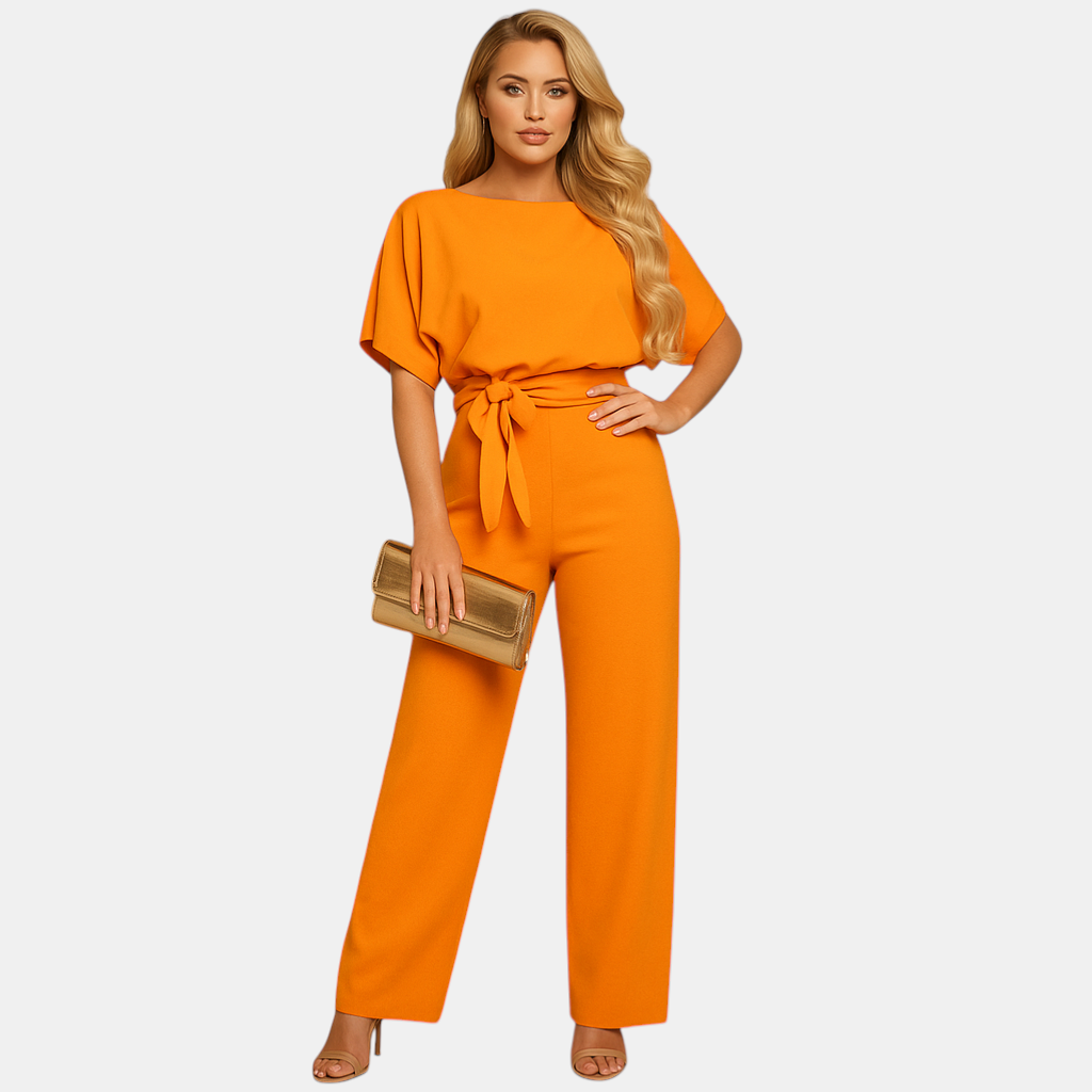 Dames jumpsuit met halternek, open rug en glitterstof – ideaal voor feestjes, gala’s en elegante gelegenheden.