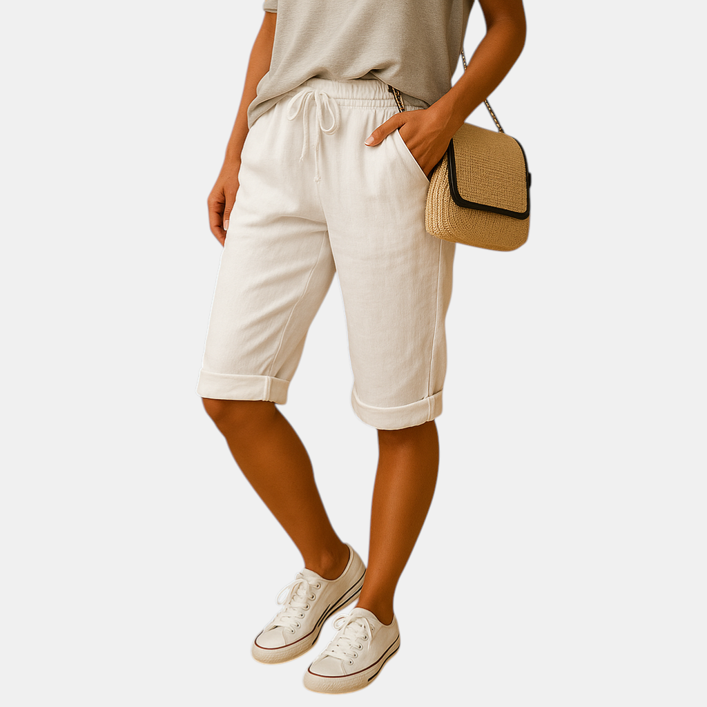 Dames capribroek met elastische taille en strikkoord, relaxed fit en opgerolde zoom, ideaal voor lente- en zomerdagen.