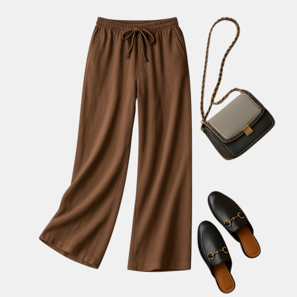 Luchtige damesbroek met elastische tailleband en losse pasvorm, geschikt voor zomerse casual of chique outfits.
