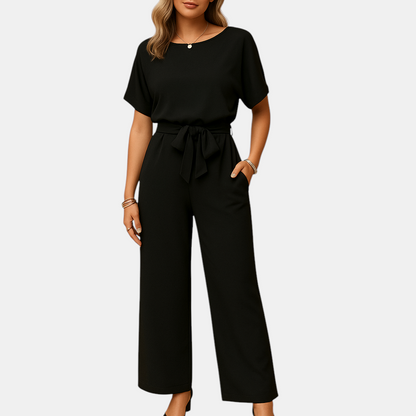 Chique dames jumpsuit in zwart, beige of groen met getailleerde pasvorm en losvallende mouwen, ideaal voor formele en stijlvolle gelegenheden.