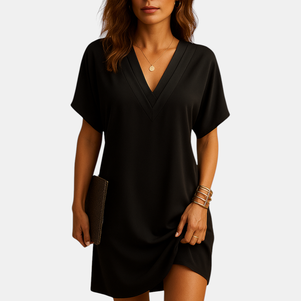 Elegante damesjurk met V-hals en splitmouwen, knielang model in zachte stof, ideaal voor casual en feestelijke gelegenheden.