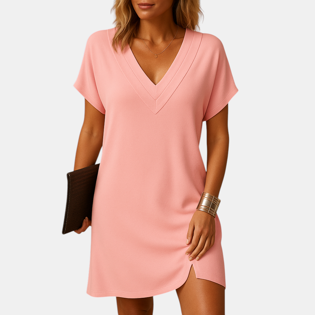 Elegante damesjurk met V-hals en splitmouwen, knielang model in zachte stof, ideaal voor casual en feestelijke gelegenheden.