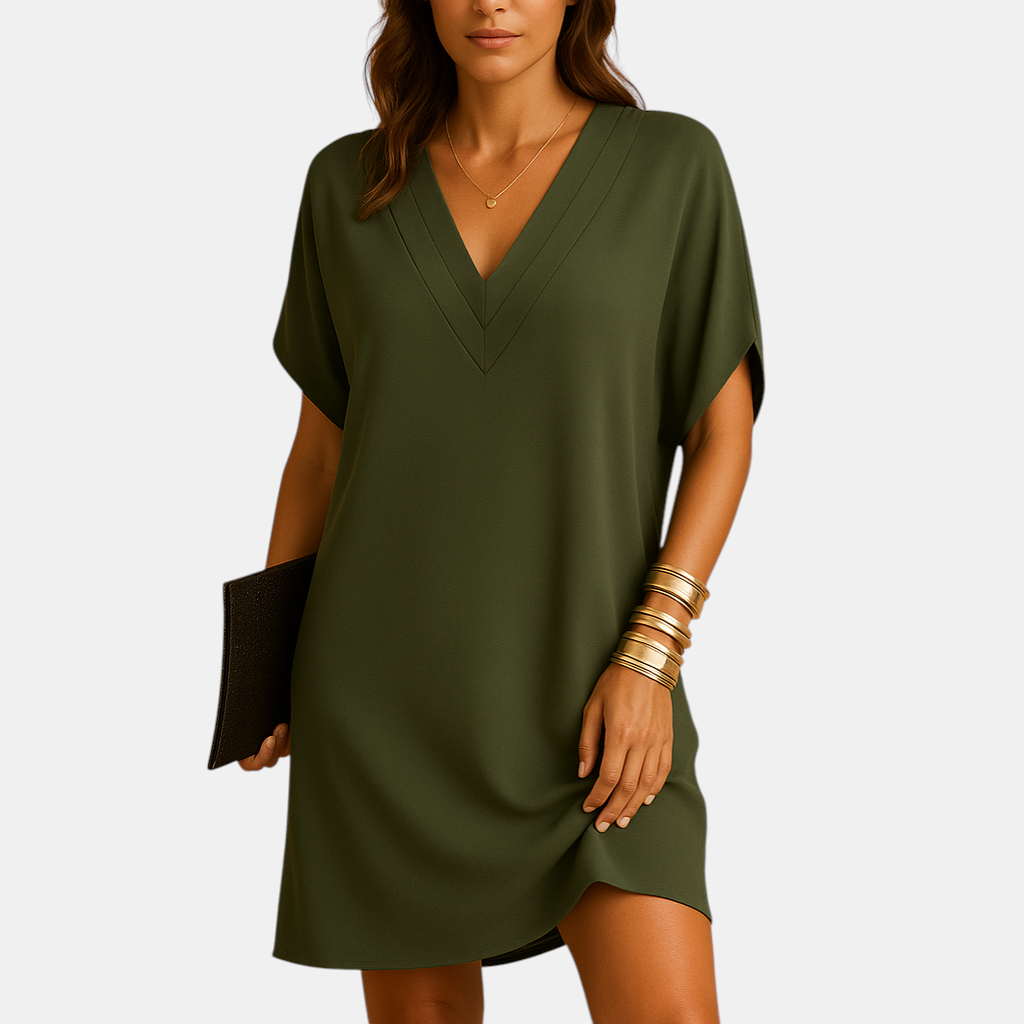 Elegante damesjurk met V-hals en splitmouwen, knielang model in zachte stof, ideaal voor casual en feestelijke gelegenheden.