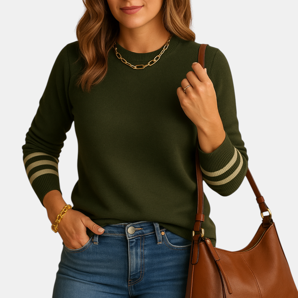 Gebreide damestrui met gestreepte mouwen, relaxte pasvorm en ademend materiaal. Perfect voor stijlvolle en veelzijdige outfits in elk seizoen.