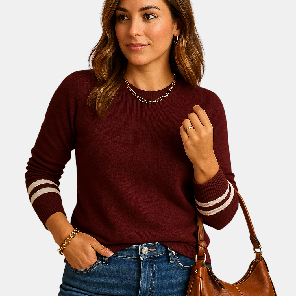Gebreide damestrui met gestreepte mouwen, relaxte pasvorm en ademend materiaal. Perfect voor stijlvolle en veelzijdige outfits in elk seizoen.