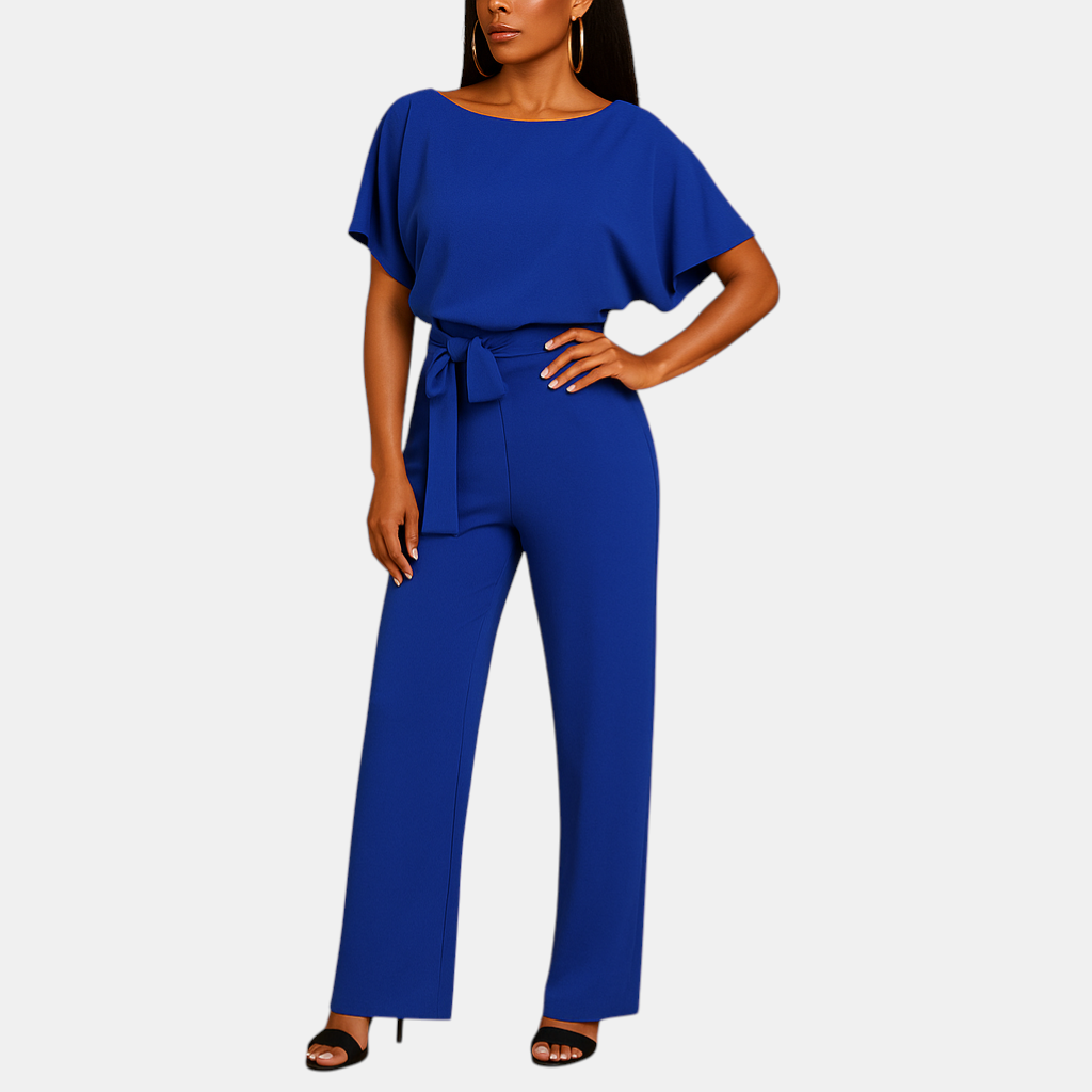 Dames jumpsuit met halternek, open rug en glitterstof – ideaal voor feestjes, gala’s en elegante gelegenheden.