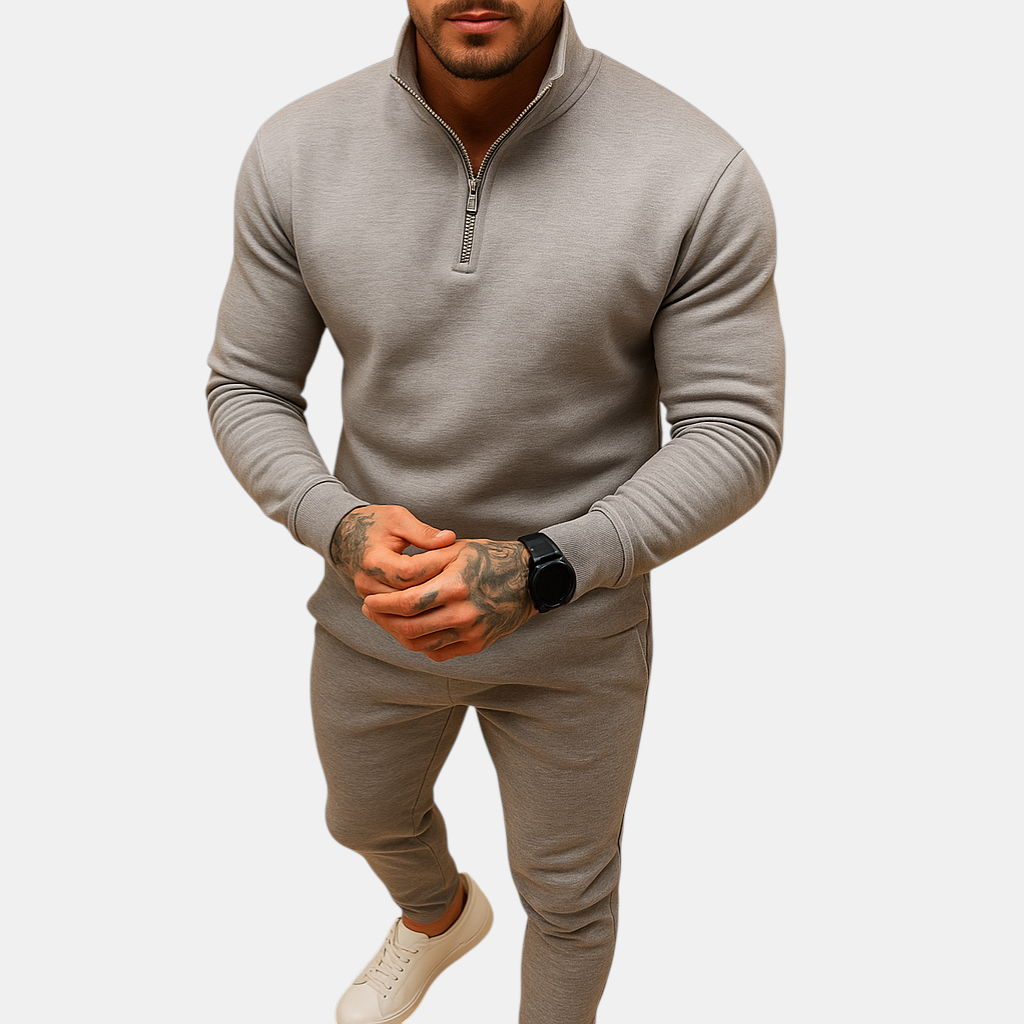 Joggingpak voor heren met halve rits trui en joggingbroek, beschikbaar in zwart, grijs, wit en khaki – ideaal voor thuis of onderweg.