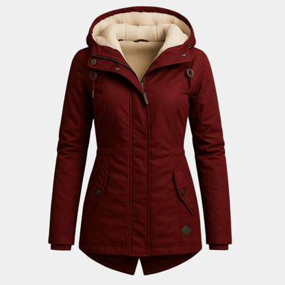 Lange winterjas voor dames met warme voering en stijlvolle pasvorm, geschikt voor casual en formele winterdagen.