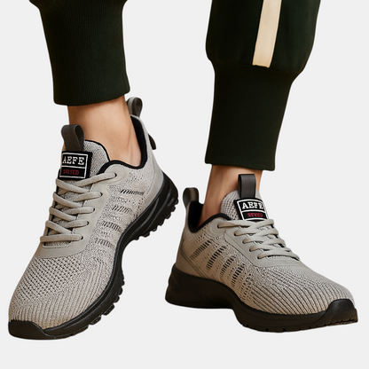 Lichtgewicht sportschoenen voor heren in oranje, grijs of groen met ademend ontwerp, comfortabele pasvorm en moderne uitstraling – ideaal voor dagelijks gebruik.
