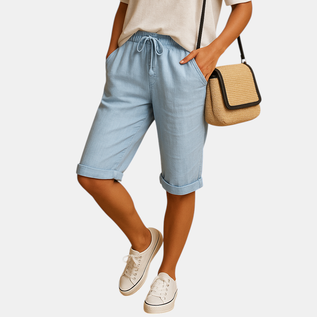 Dames capribroek met elastische taille en strikkoord, relaxed fit en opgerolde zoom, ideaal voor lente- en zomerdagen.