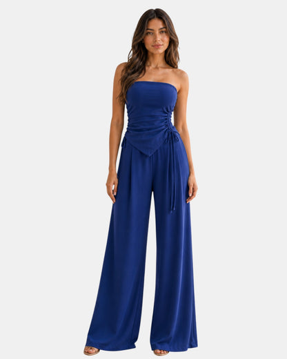 Luxen-Amsterdam blauwe strapless top met ruches en wijde pijpen broek, verstelbaar strikdetail, elegante zomerse set.