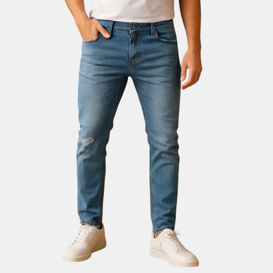 Slim fit herenjeans in blauw of grijs met gescheurd detail, gemaakt van duurzaam stretchdenim voor een stoere en comfortabele urban look.