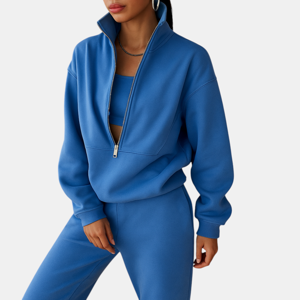 Tweedelig joggingpak voor dames met vest en halve rits in roze, groen of blauw – ideaal voor loungen of sportieve dagen.