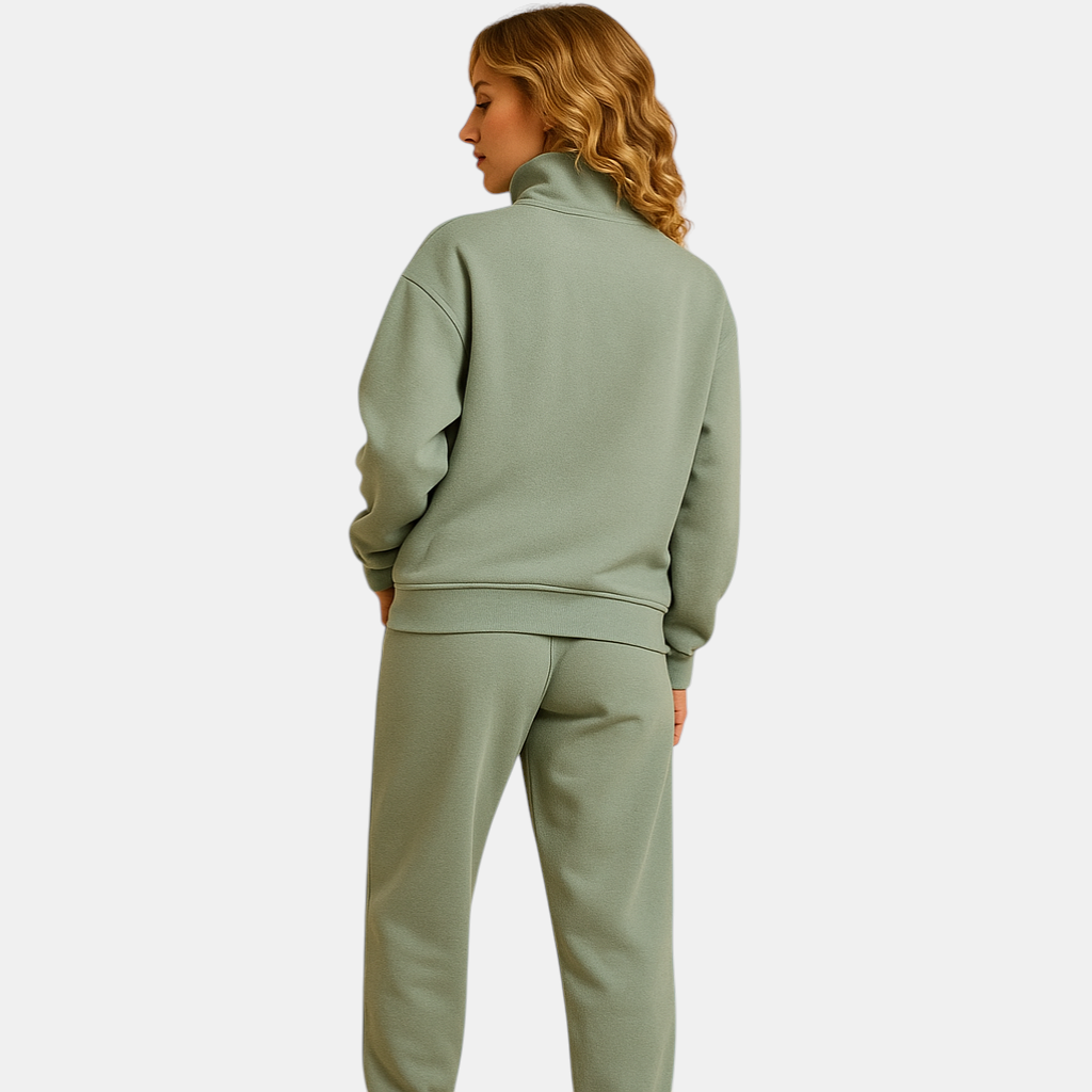 Tweedelig joggingpak voor dames met vest en halve rits in roze, groen of blauw – ideaal voor loungen of sportieve dagen.