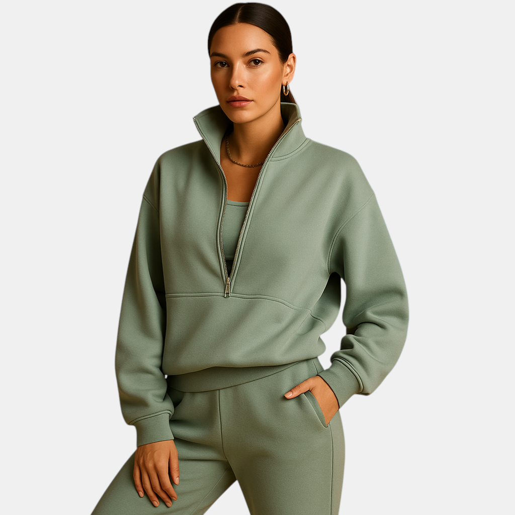 Stijlvol tweedelig joggingpak voor dames met halve rits en sportieve look in roze, groen of blauw.